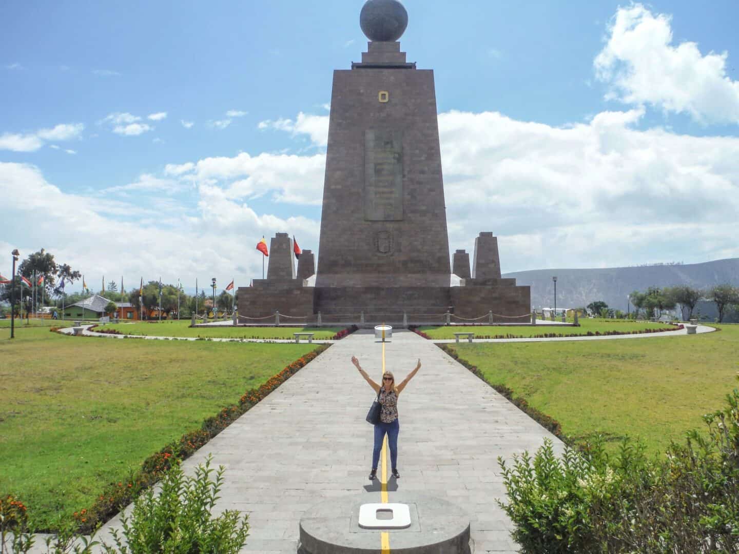 Ellie Quinn at Equator Line, one foot on each sides | Ecuador Itinerary