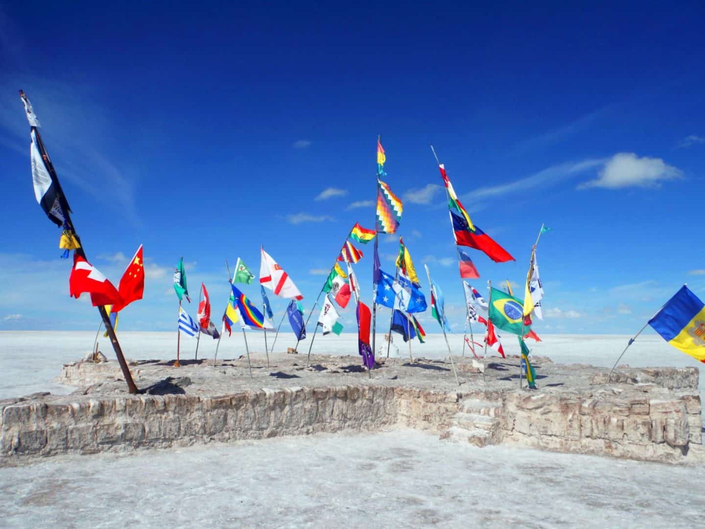 Bolivia- The famous flags at the Salt Flats - The Wandering Quinn Travel Blog