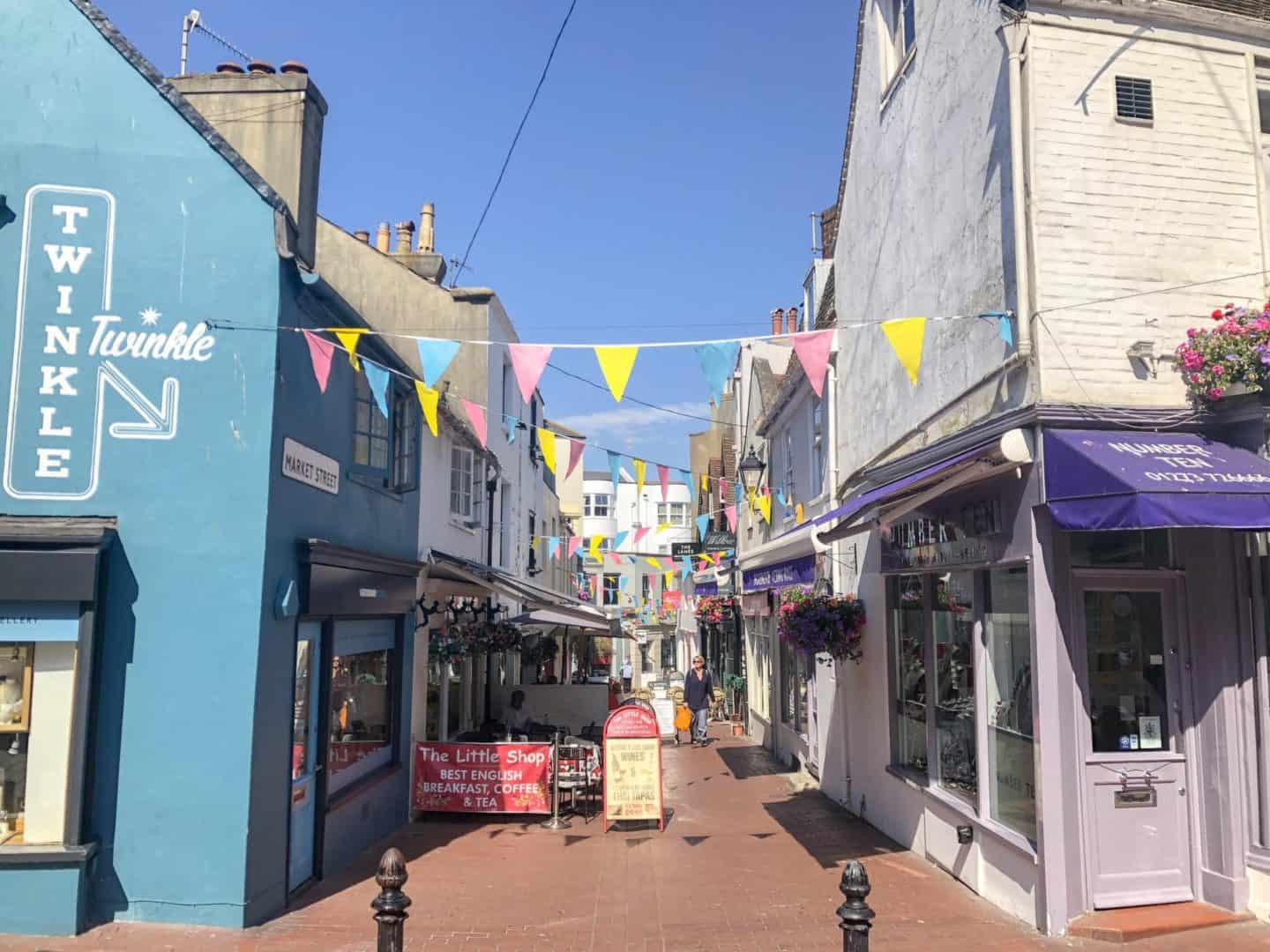 Brighton lanes colourful buildings blue sky | Brighton day trip from London by train