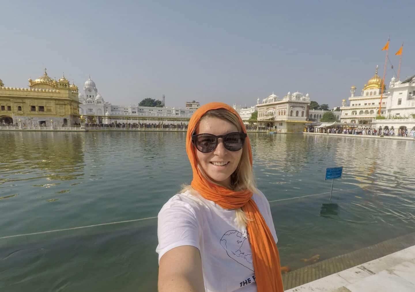 Golden Temple Amritsar - ellie quinn in orange head scarf in the golden temple in Amritsar