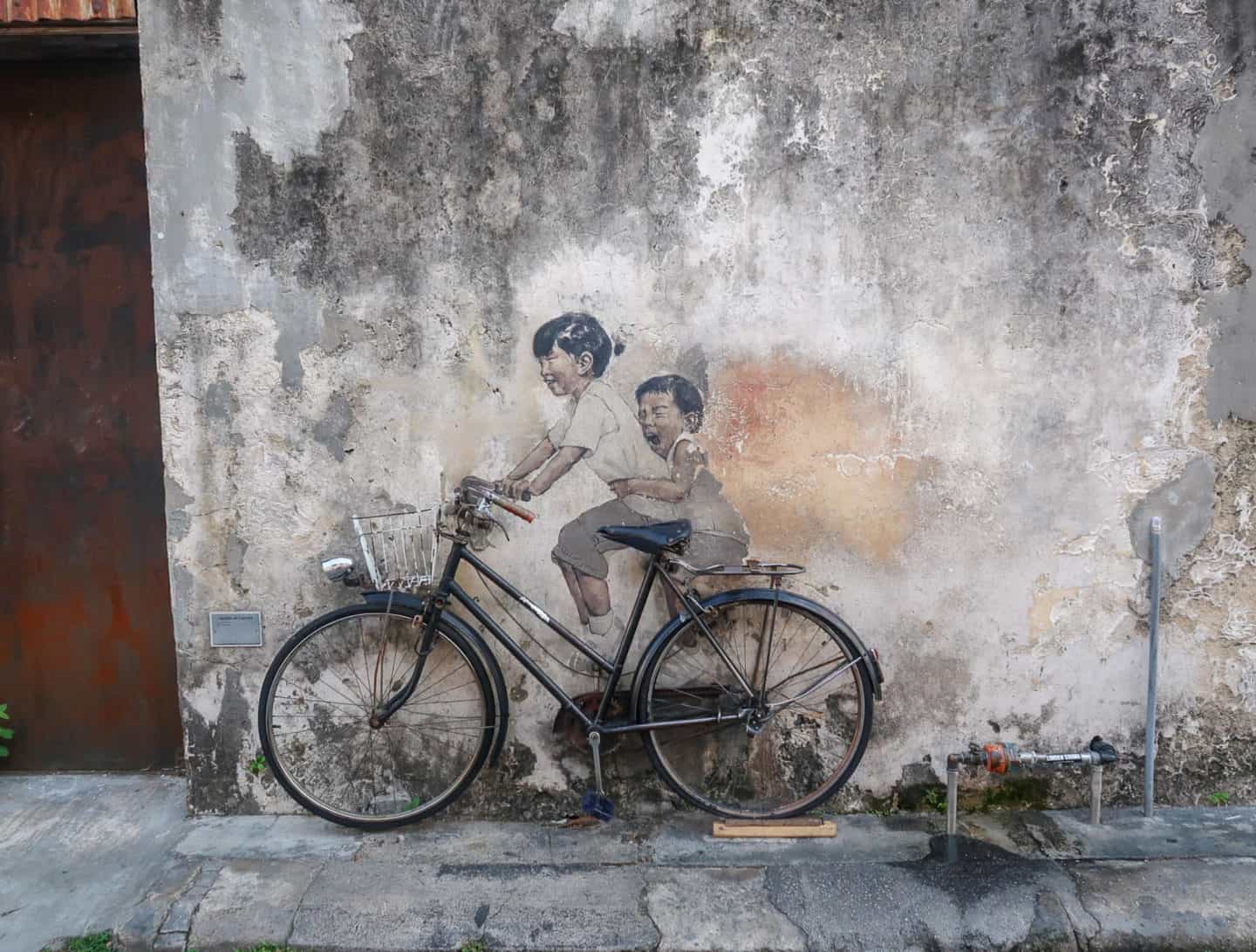Georgetown street art children on bike - Things To Do in Georgetown Malaysia, Georgetown famous street art