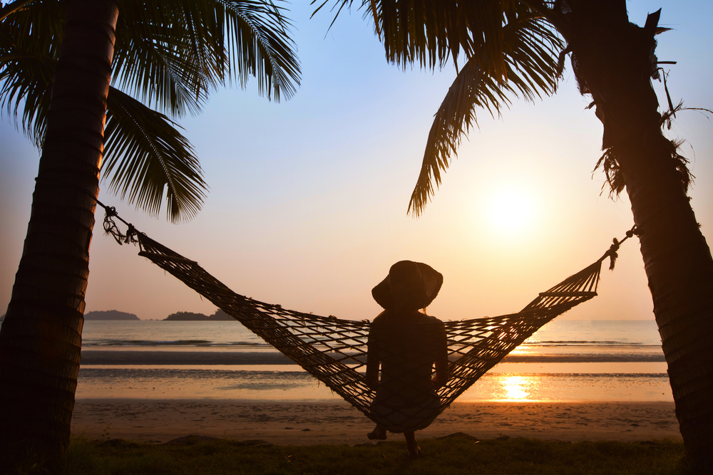 Thailand female packing list, female on hammock watching sunset - Thailand female packing list, female on hammock watching sunset
