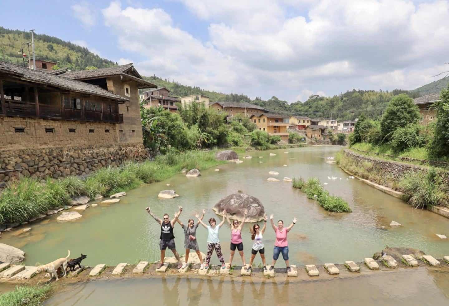 Fujian China - people standing in river in china | backpacking checklist