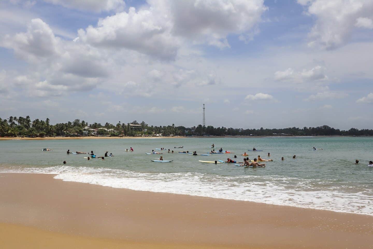 Arugam Bay Elephant Point Surfing - Things to do in Arugam Bay, surfers in the ocean in Arugam Bay