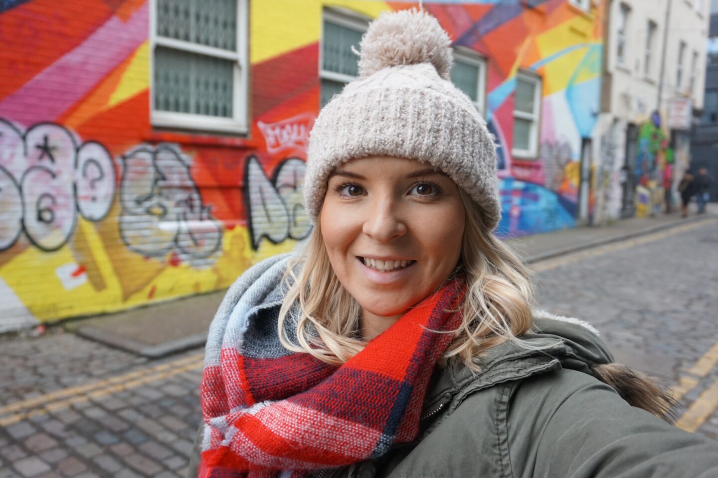 Winter outfits london - London in Winter, ellie quinn in woolly hat with street art