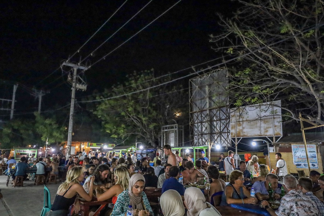 Gili T night market - things to do in Gili Trawangan, people sat at Gili T night market