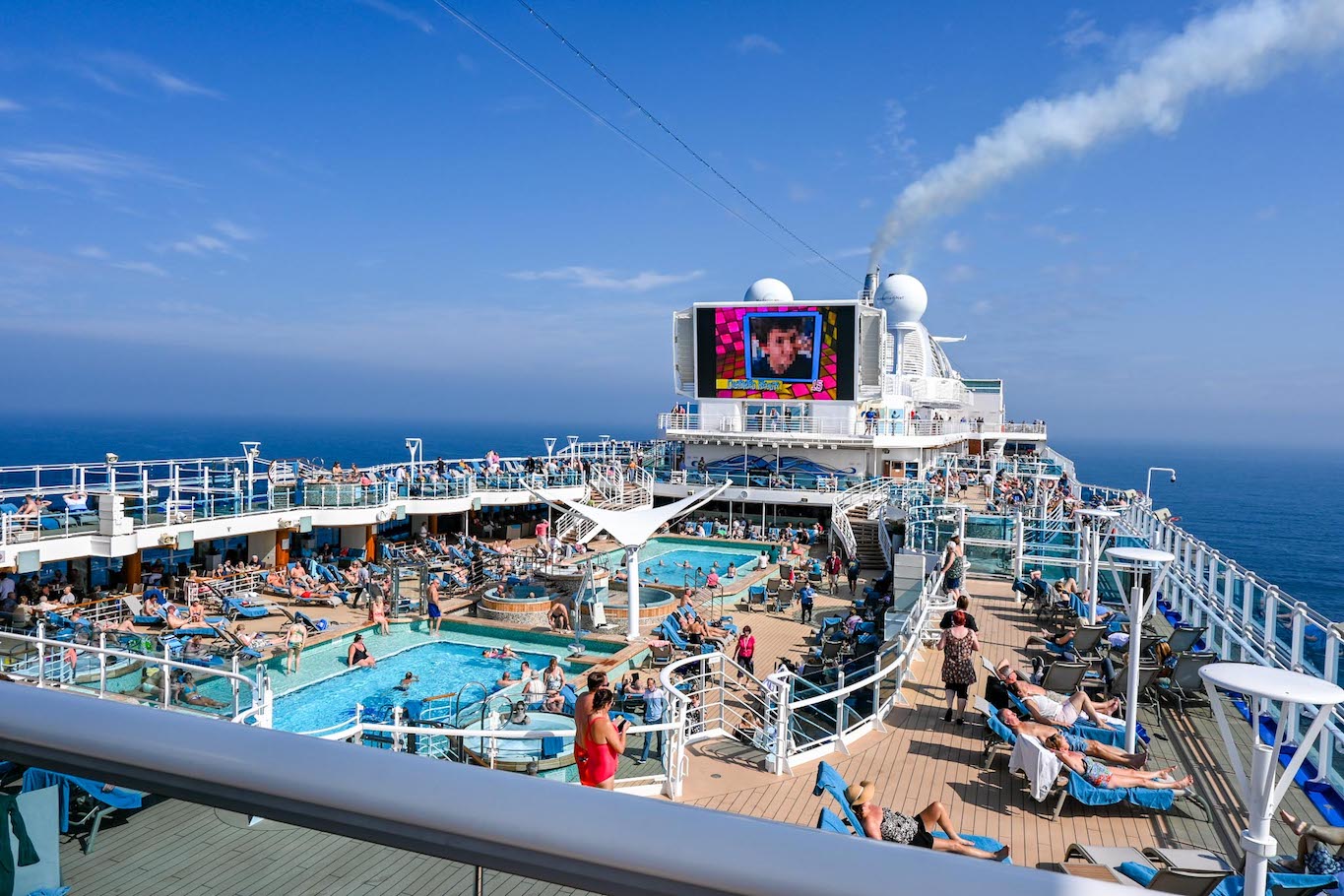 going on a cruise alone, busy pool area - going on a cruise alone, busy pool area