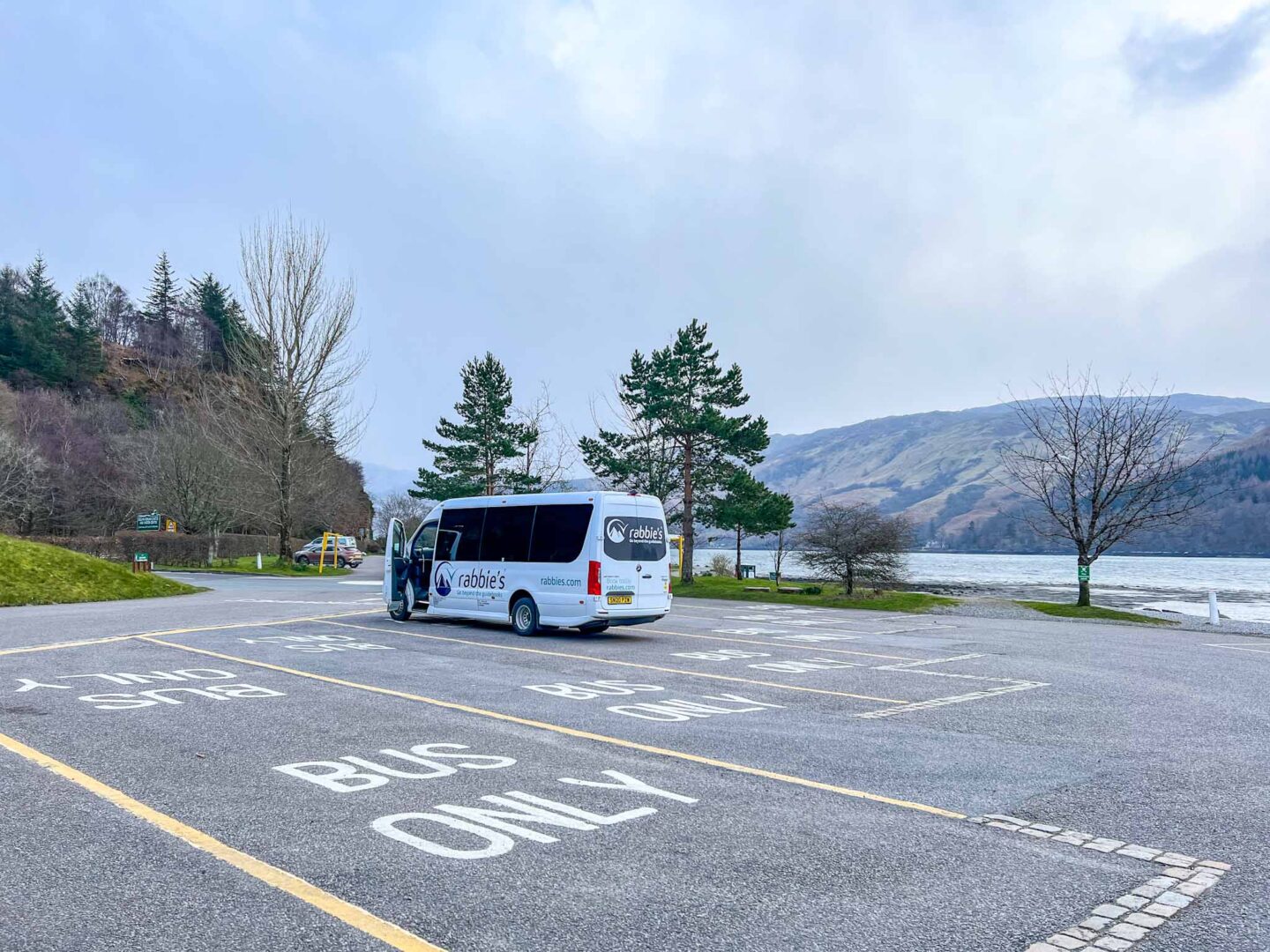 Isle of Skye tour, Rabbies Coach in car park - Isle of Skye tour, Rabbies Coach in car park