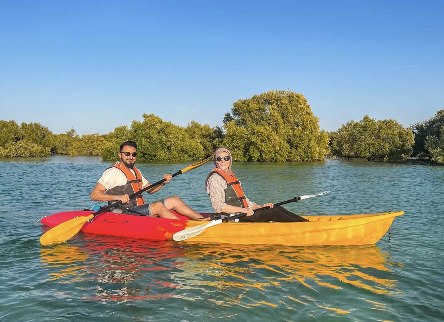 Things to do in Abu Dhabi, couple kayaking in Abu Dhabi - Things to do in Abu Dhabi, couple kayaking in Abu Dhabi