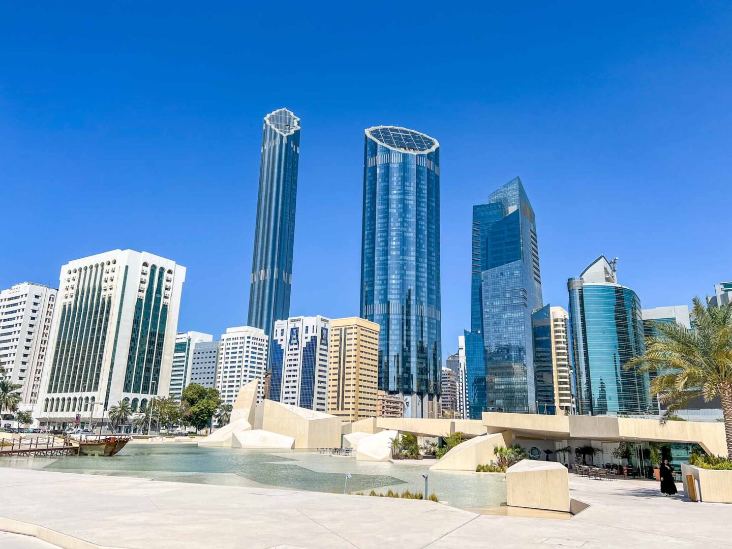 Things to do in Abu Dhabi, square with water, cafe and skyscrapers - Things to do in Abu Dhabi, square with water, cafe and skyscrapers