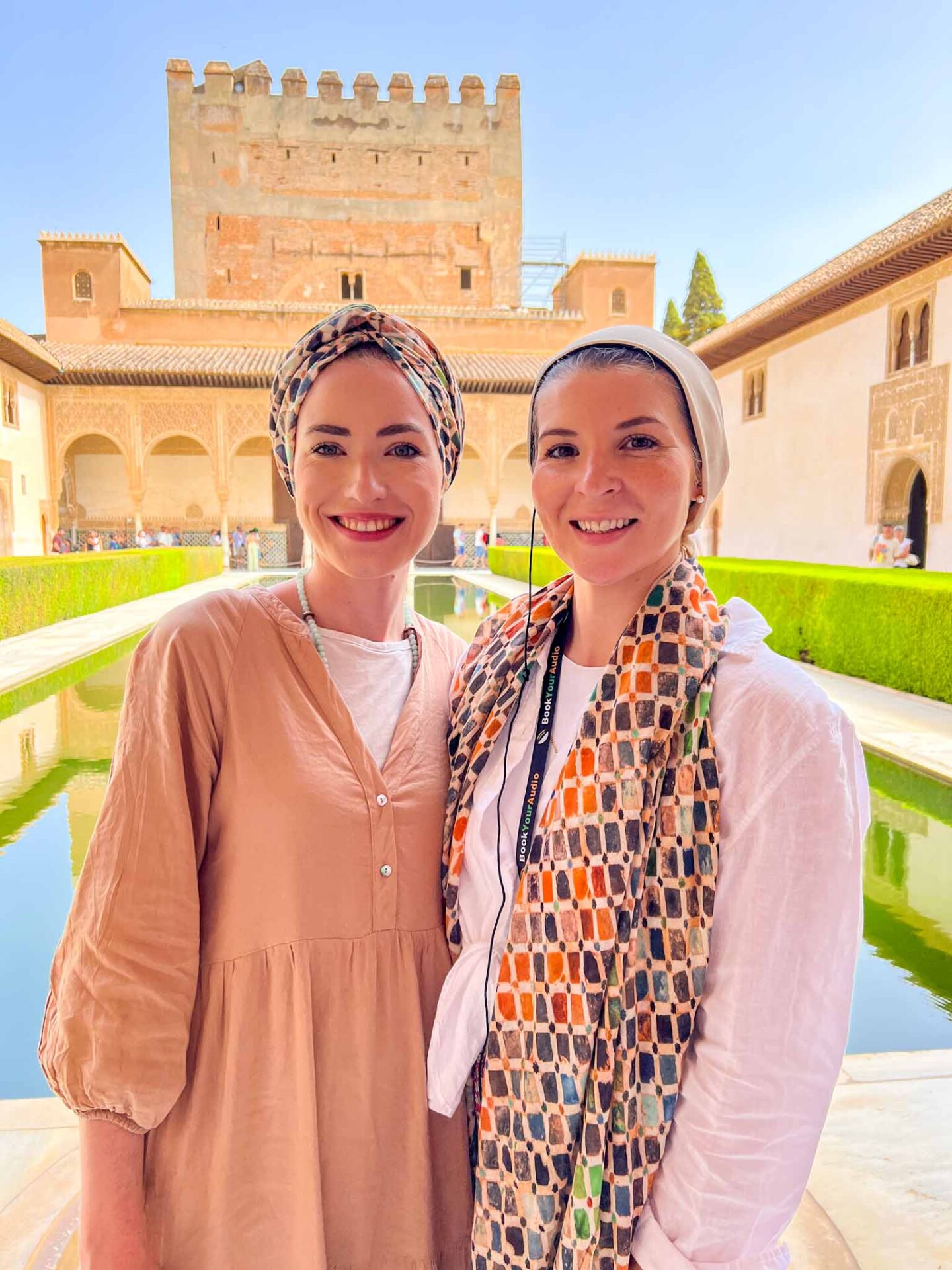 travel tips for Muslim Women, Ellie and abdiya wearing hijab and modest clothing in Alhambra Spain - travel tips for Muslim Women, Ellie and abdiya wearing hijab and modest clothing in Alhambra Spain