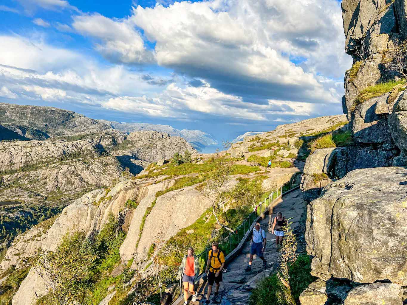 Pulpit Rock hike, Preikestolen hiking trail climbers over rock - Pulpit Rock hike, Preikestolen hiking trail climbers over rock