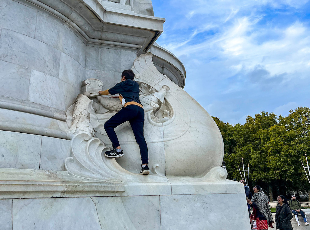 kids playing outside Buckingham Palace, London with kids, London with kids itinerary, - The Wandering Quinn Travel Blog kids playing outside Buckingham Palace, London with kids, London with kids itinerary,