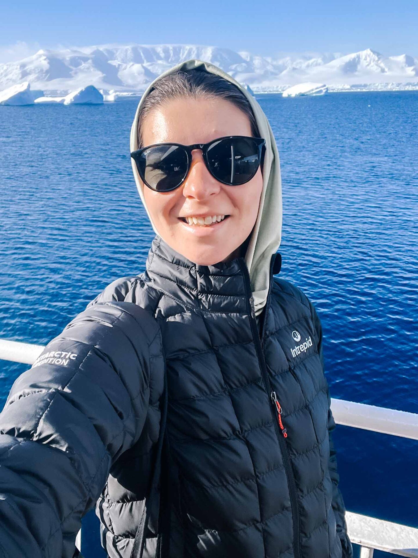Ellie in down jacket in Antarctica, What to wear in Antarctica, What to pack for Antarctica, - Ellie in down jacket in Antarctica, What to wear in Antarctica, What to pack for Antarctica,