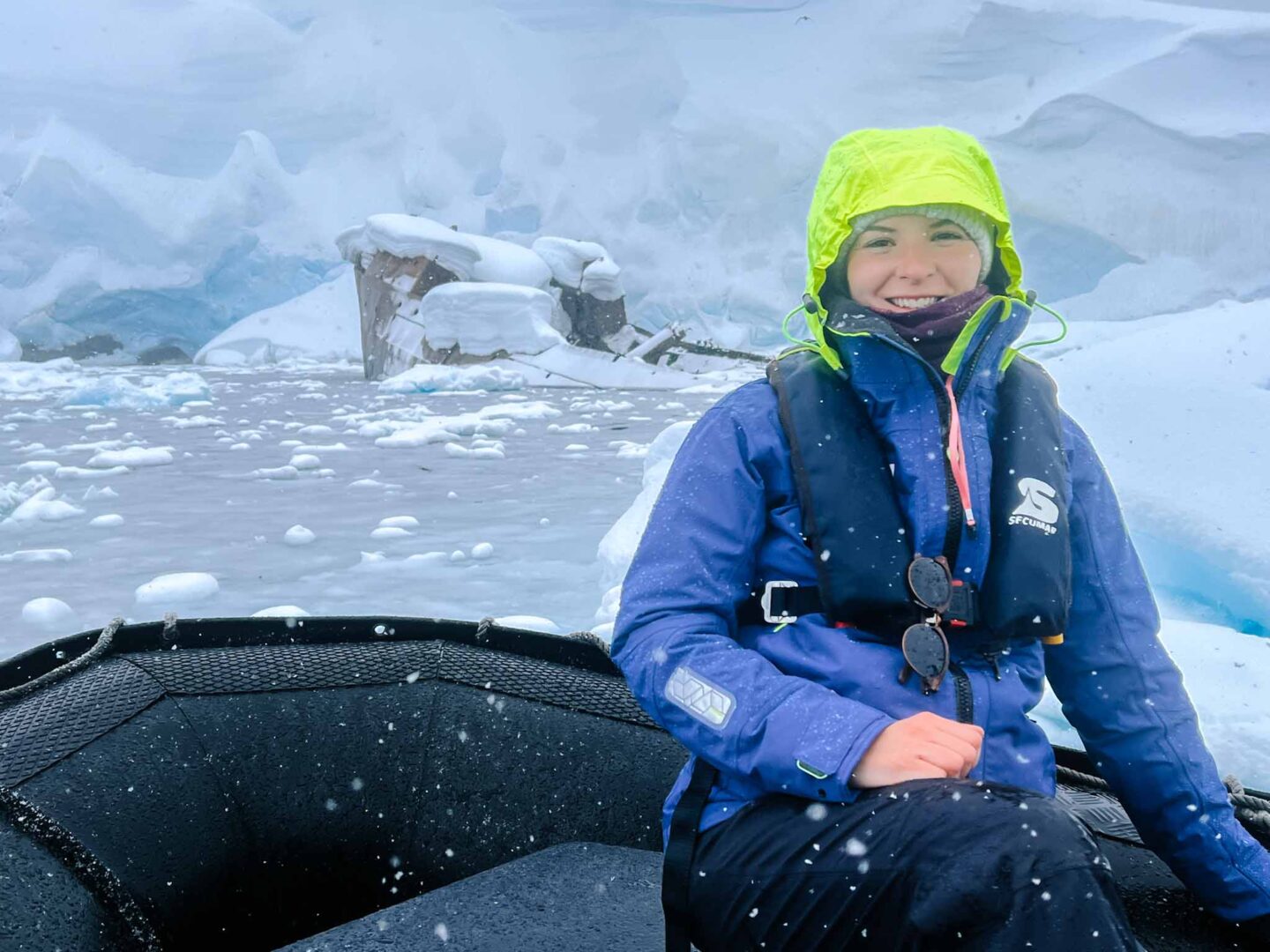 Ellie on end of Zodiac with pink lanyard, Ellie with hat, What to wear in Antarctica, What to pack for Antarctica, - Ellie on end of Zodiac with pink lanyard, Ellie with hat, What to wear in Antarctica, What to pack for Antarctica,