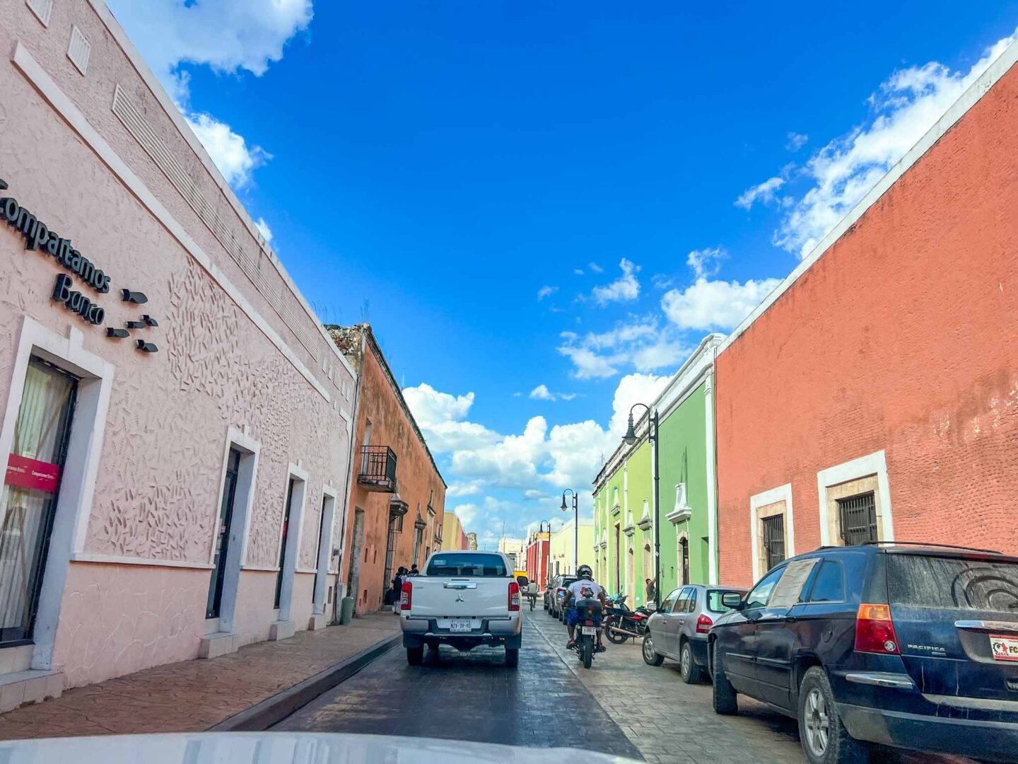 Driving into Valladolid with colourful buildings, Yucatan Road Trip, 1 week Mexico itinerary, - Driving into Valladolid with colourful buildings, Yucatan Road Trip, 1 week Mexico itinerary,