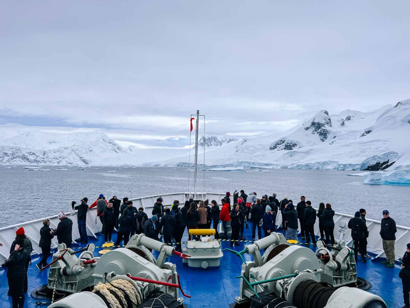 passengers on front of ship in Antarctica, Can you visit Antarctica, Why do people visit Antarctica, - The Wandering Quinn Travel Blog passengers on front of ship in Antarctica, Can you visit Antarctica, Why do people visit Antarctica,