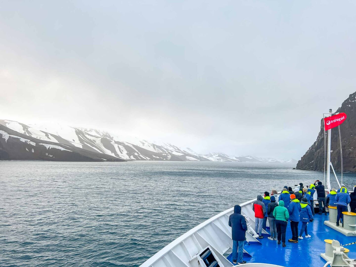 IMG_8379 - passengers on front of the ship in Antarctica, Can you visit Antarctica, Why do people visit Antarctica,