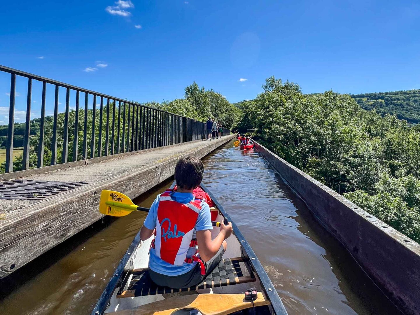 best places to visit in Wales, boy canoeing over Pontcysyllte aqueduct - best places to visit in Wales, boy canoeing over Pontcysyllte aqueduct