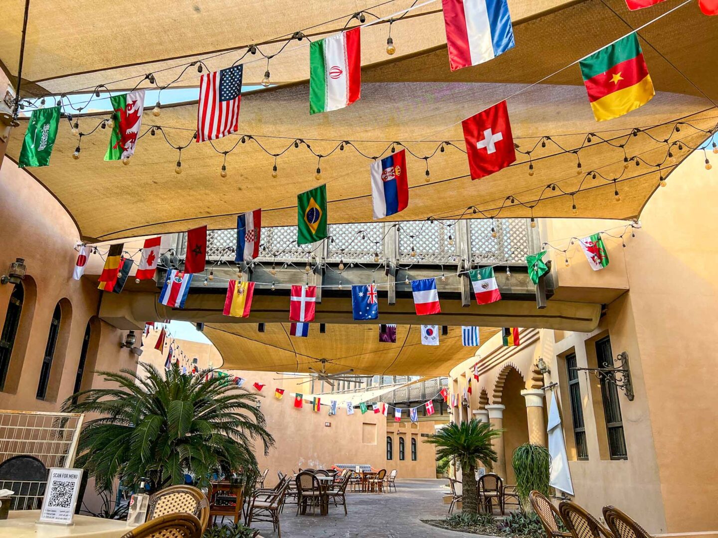 Katara Cultural Village streets with flags, Qatar Stopover, one day in Doha, - Katara Cultural Village streets with flags, Qatar Stopover, one day in Doha,