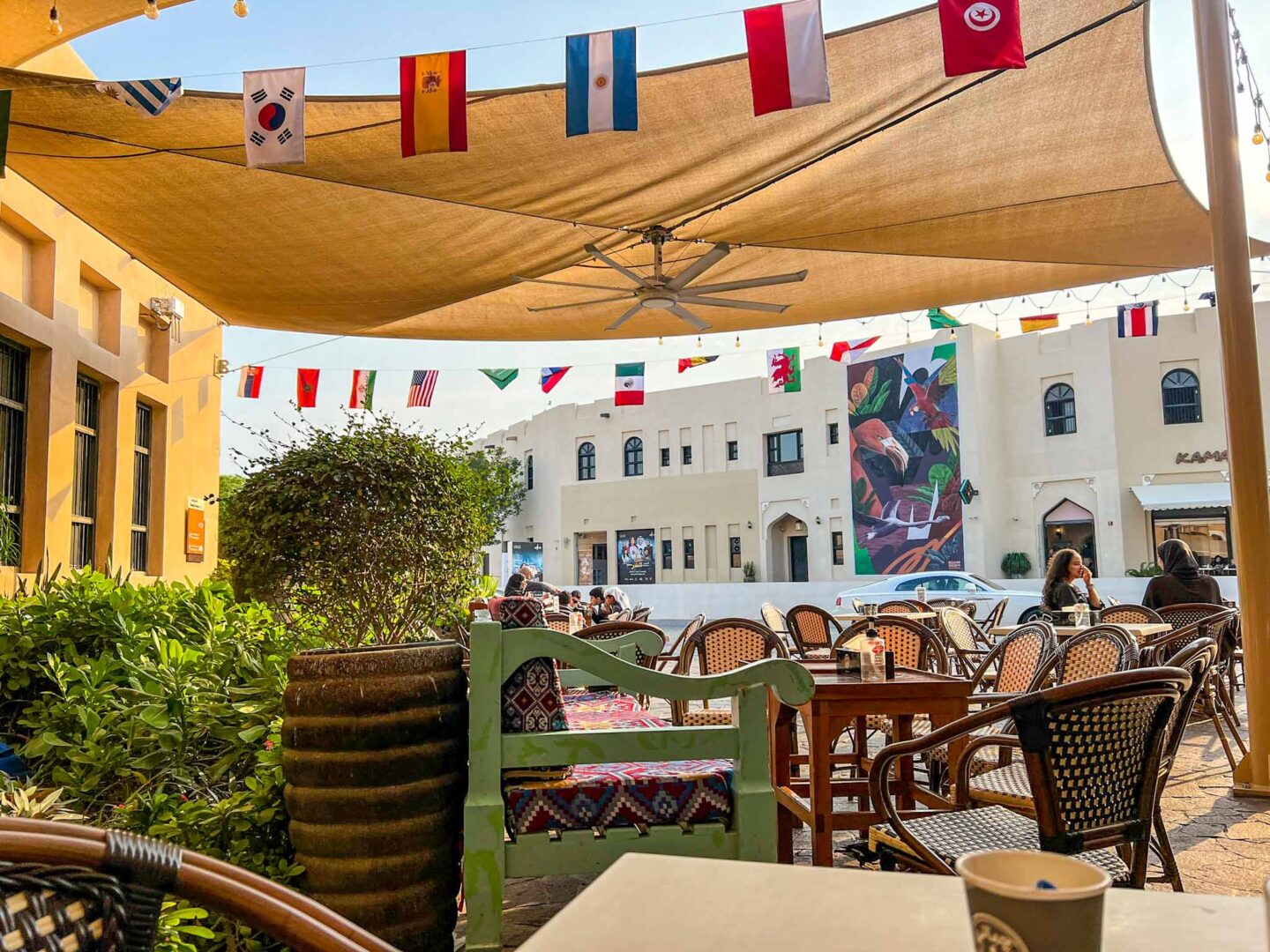 outside seating at Chapati and Karak with flags,Doha itinerary, Qatar itinerary - outside seating at Chapati and Karak with flags,Doha itinerary, Qatar itinerary