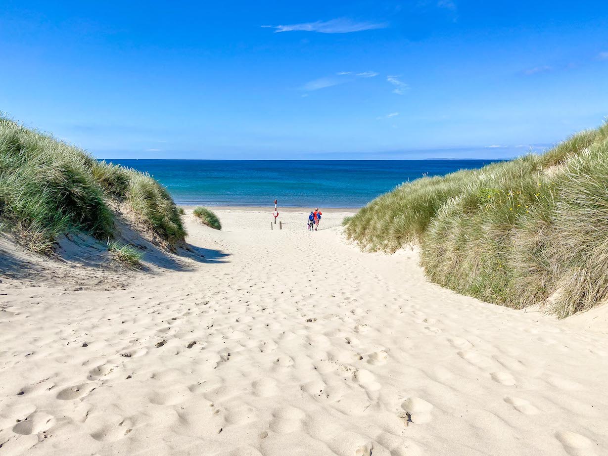 things to do in, Harlech beach with white sand and blue sky - things to do in, Harlech beach with white sand and blue sky