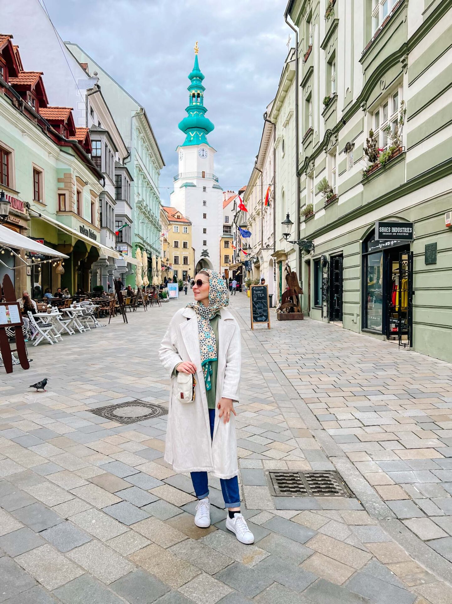 one day in Bratislava, Ellie in Bratislava with tower behind - one day in Bratislava, Ellie in Bratislava with tower behind