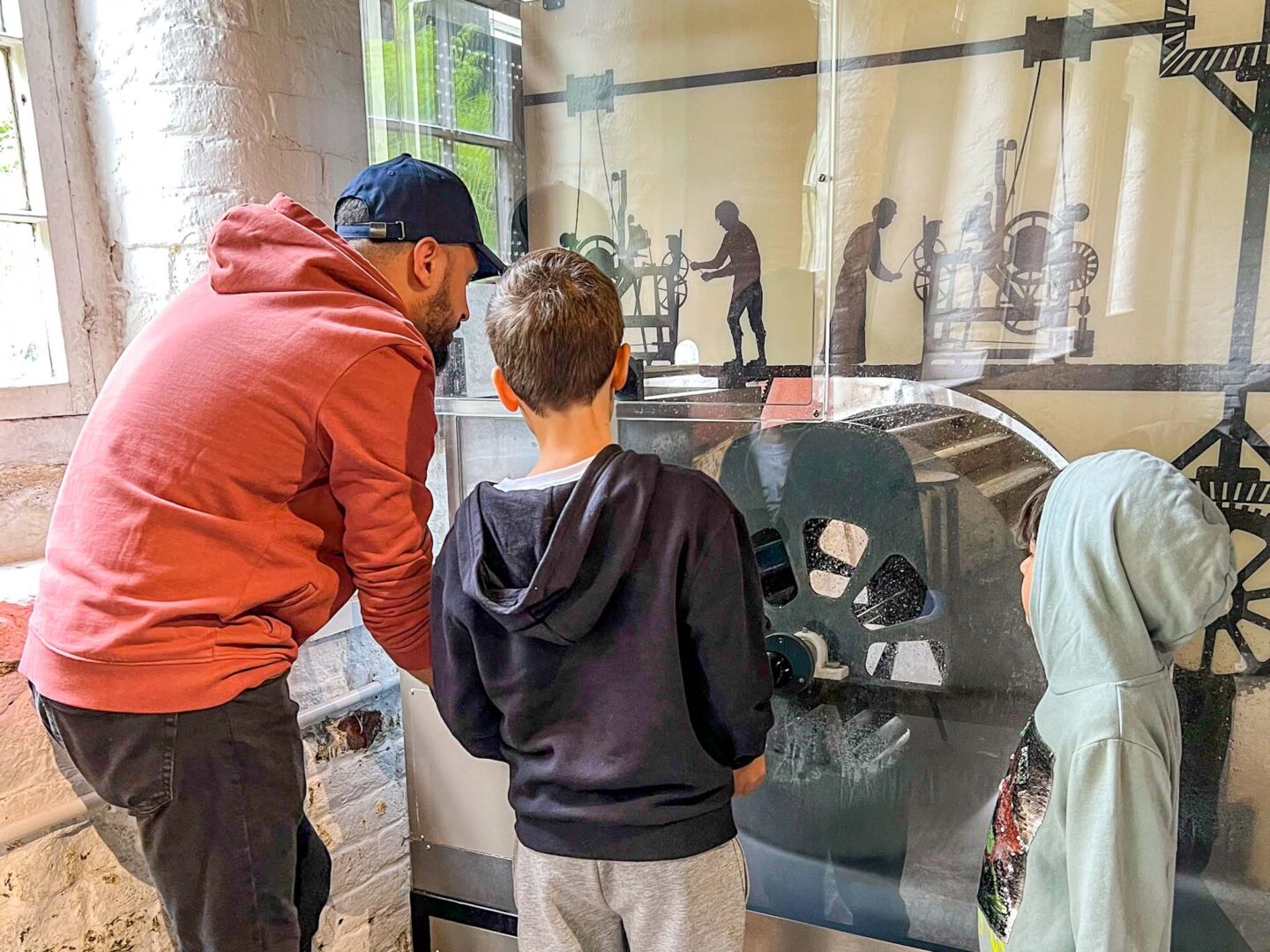 National Trust Manchester, family inside Quarry Bank Mill - National Trust Manchester, family inside Quarry Bank Mill