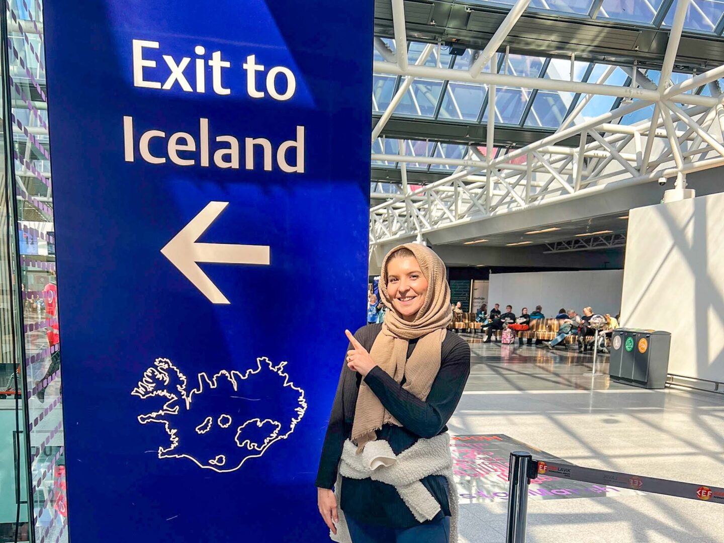 Iceland in May and June, Ellie at the exit to iceland sign - Iceland in May and June, Ellie at the exit to iceland sign