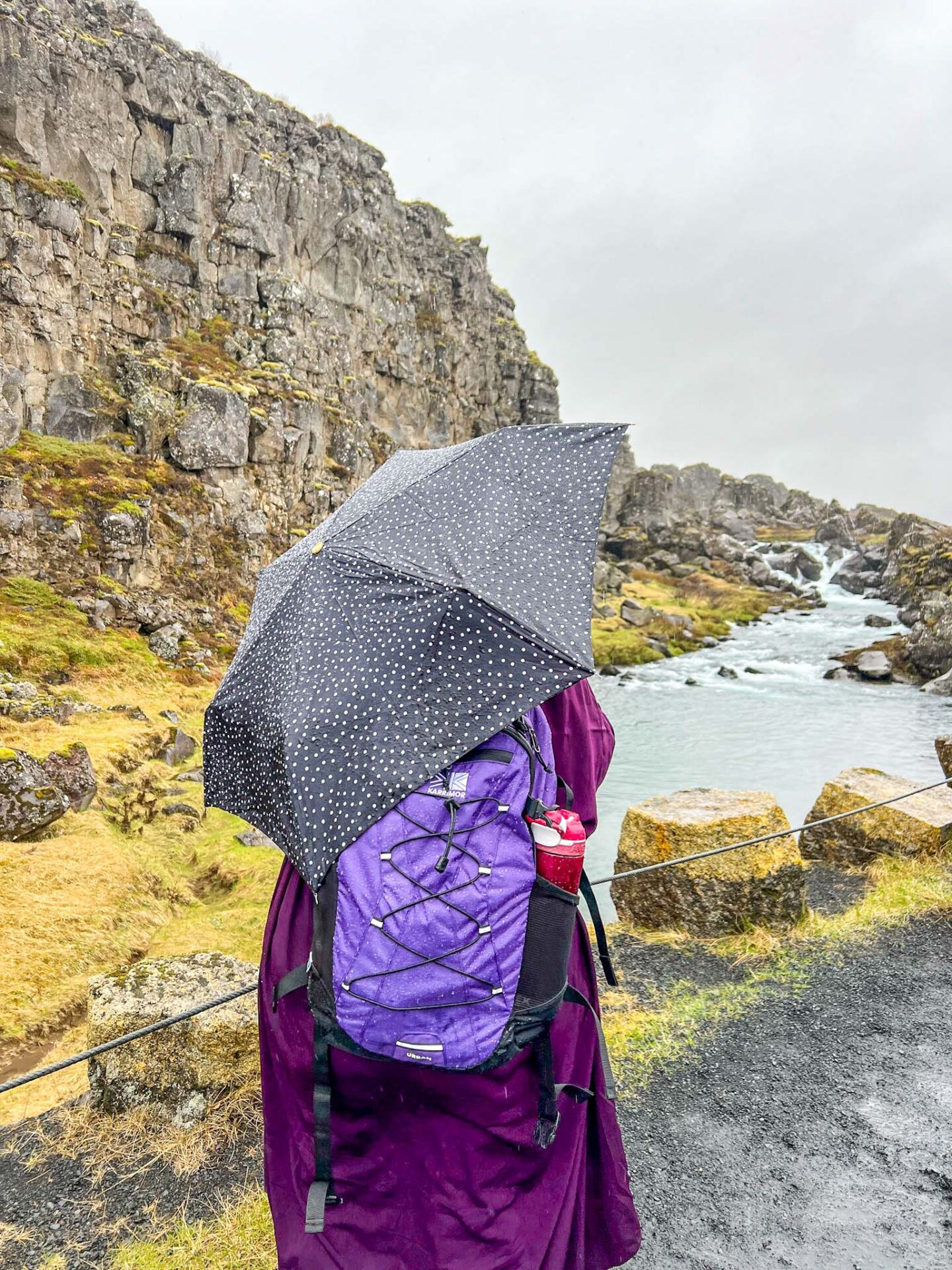 things to do in iceland in the rain, women with umbrella in iceland - things to do in iceland in the rain, women with umbrella in iceland