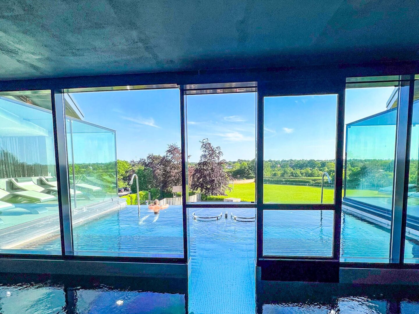 Things to do in Altrincham, infinity pool at Hale Country Club Spa with blue skies - Things to do in Altrincham, infinity pool at Hale Country Club Spa with blue skies