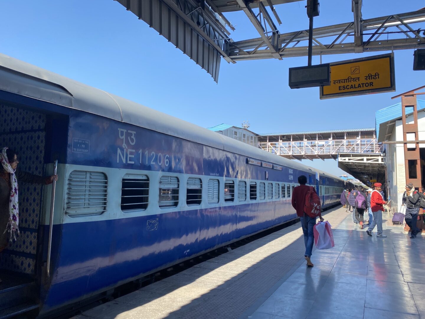 Golden Triangle India Itinerary, blue Indian train in train station - Golden Triangle India Itinerary, blue Indian train in train station