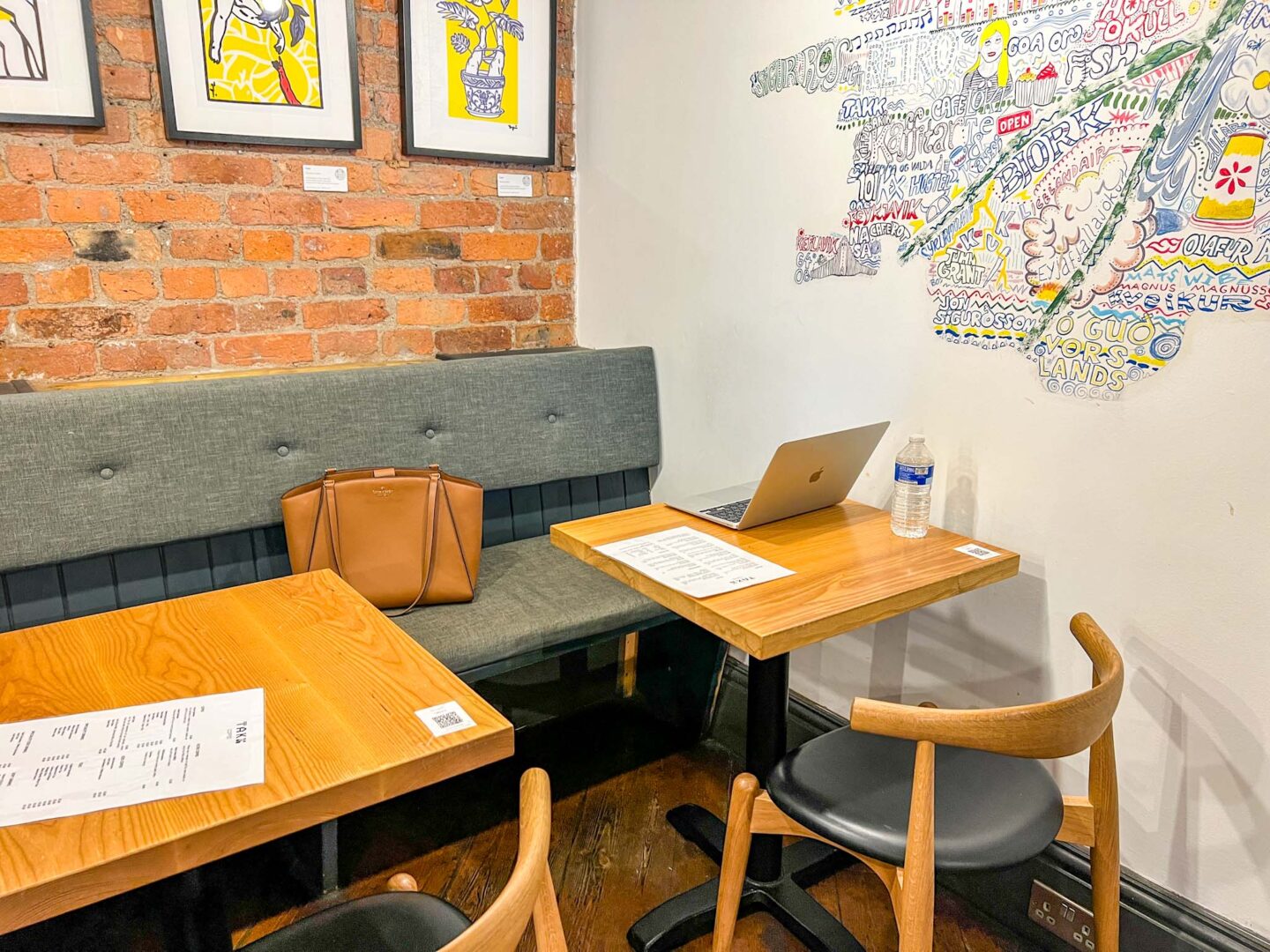 laptop on table inside Takk Cafe Manchester, Manchester cafes to work from, - laptop on table inside Takk Cafe Manchester, Manchester cafes to work from,