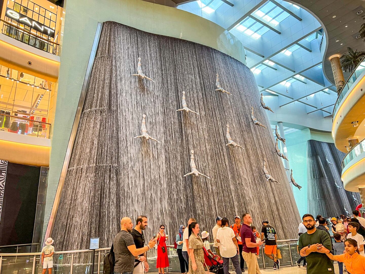 what to do in Dubai - tourists inside Dubai Mal at waterfall, What to wear in Dubai,