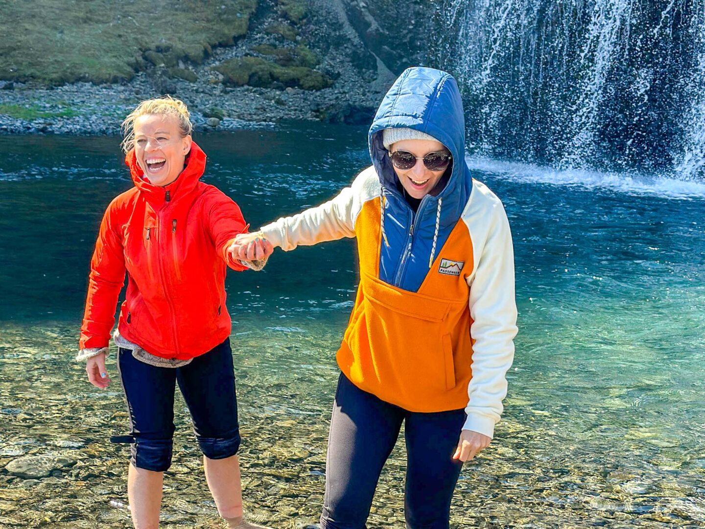 women's tour to iceland, Ellie at waterfall in iceland - women's tour to iceland, Ellie at waterfall in iceland