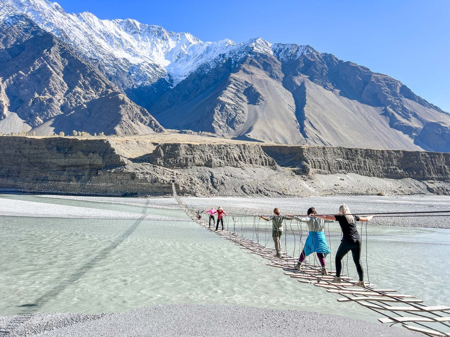 group crossing passu bridge, what to wear in Pakistan - group crossing passu bridge, what to wear in Pakistan