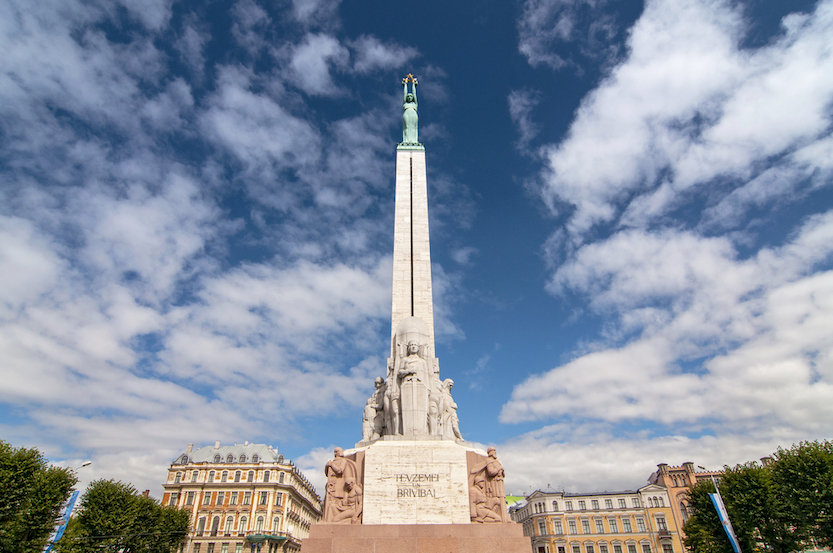 Things to do in Riga, Monument of freedom. woman holding three gold stars - Things to do in Riga, Monument of freedom. woman holding three gold stars