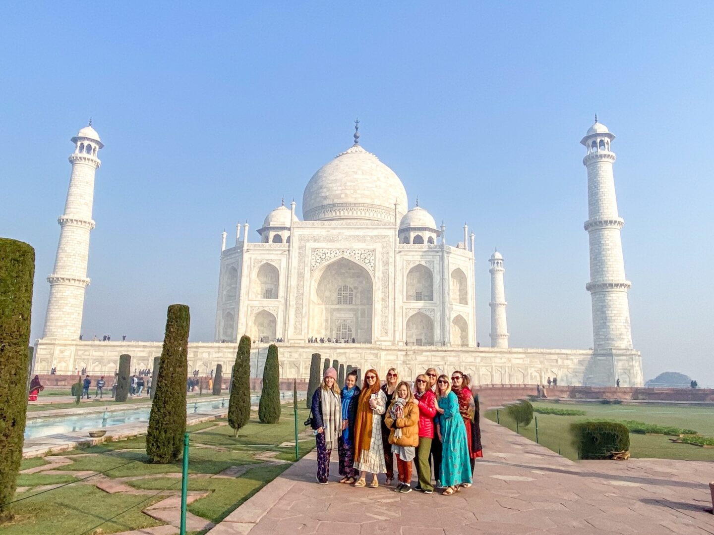 what to wear in india, female tourists at Taj Mahal in bright clothing - what to wear in india, female tourists at Taj Mahal in bright clothing