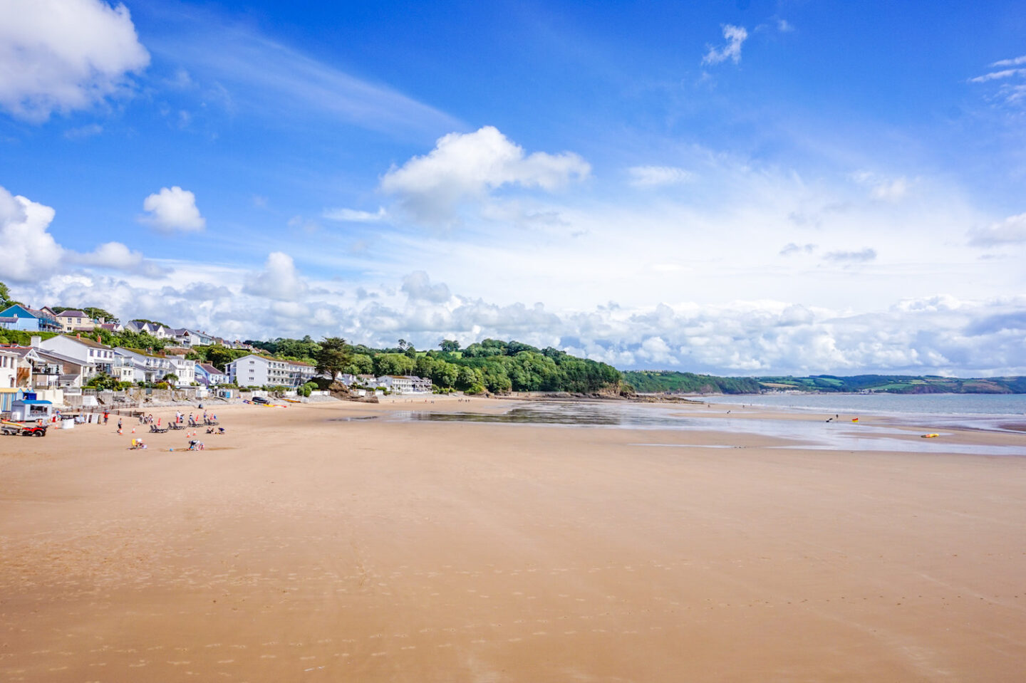 best beaches in South Wales, Saundersfoot Beach with tide out and town to the side - best beaches in South Wales, Saundersfoot Beach with tide out and town to the side
