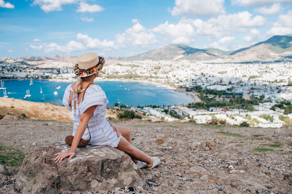 what to wear in Turkey, woman in white dress overlooking Bodrum - what to wear in Turkey, woman in white dress overlooking Bodrum