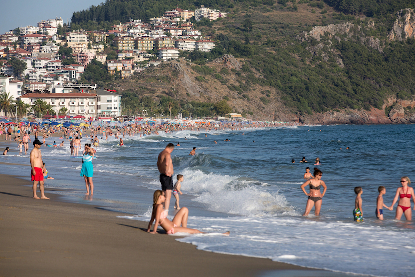 what to wear in Turkey, beach in Turkey with tourists on - what to wear in Turkey, beach in Turkey with tourists on