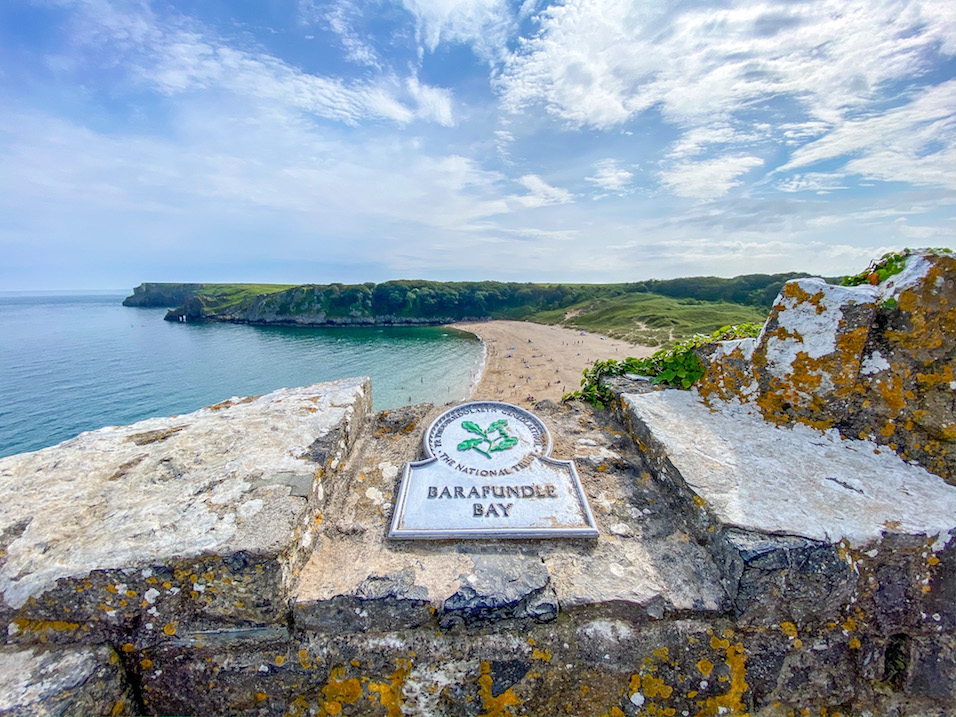 best beaches in South Wales, Barafundle Bay Beach from top with sign - best beaches in South Wales, Barafundle Bay Beach from top with sign