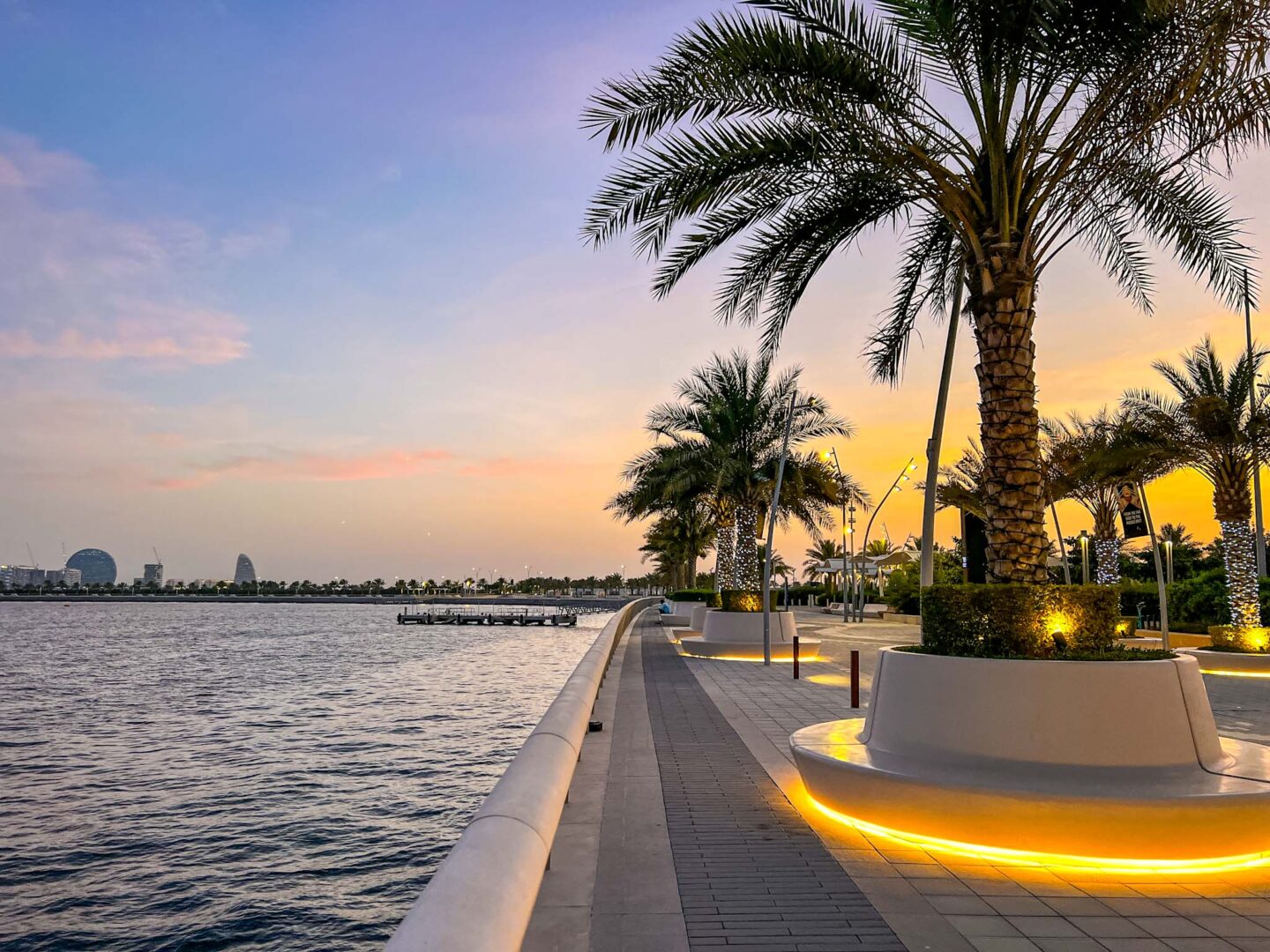 Dubai vs Abu Dhabi, sunset on Yas Island walkway