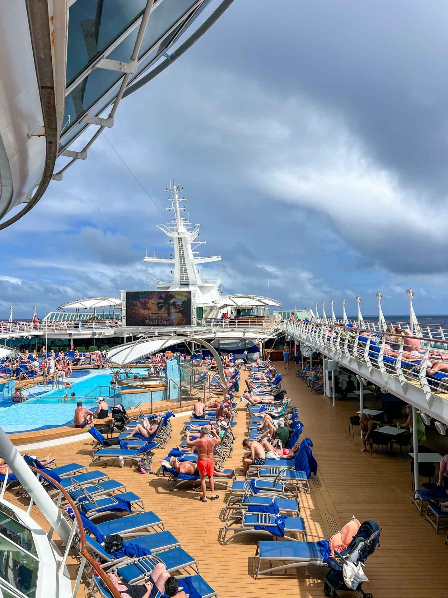 Tui cruise review, passengers by pool on cruise ship