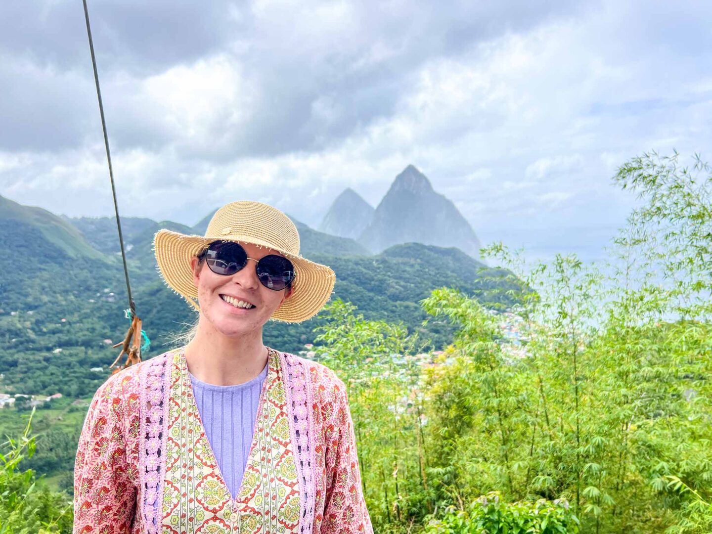how to see islands on a Caribbean cruise, Ellie in St Lucia with Pitons behind - how to see islands on a Caribbean cruise, Ellie in St Lucia with Pitons behind