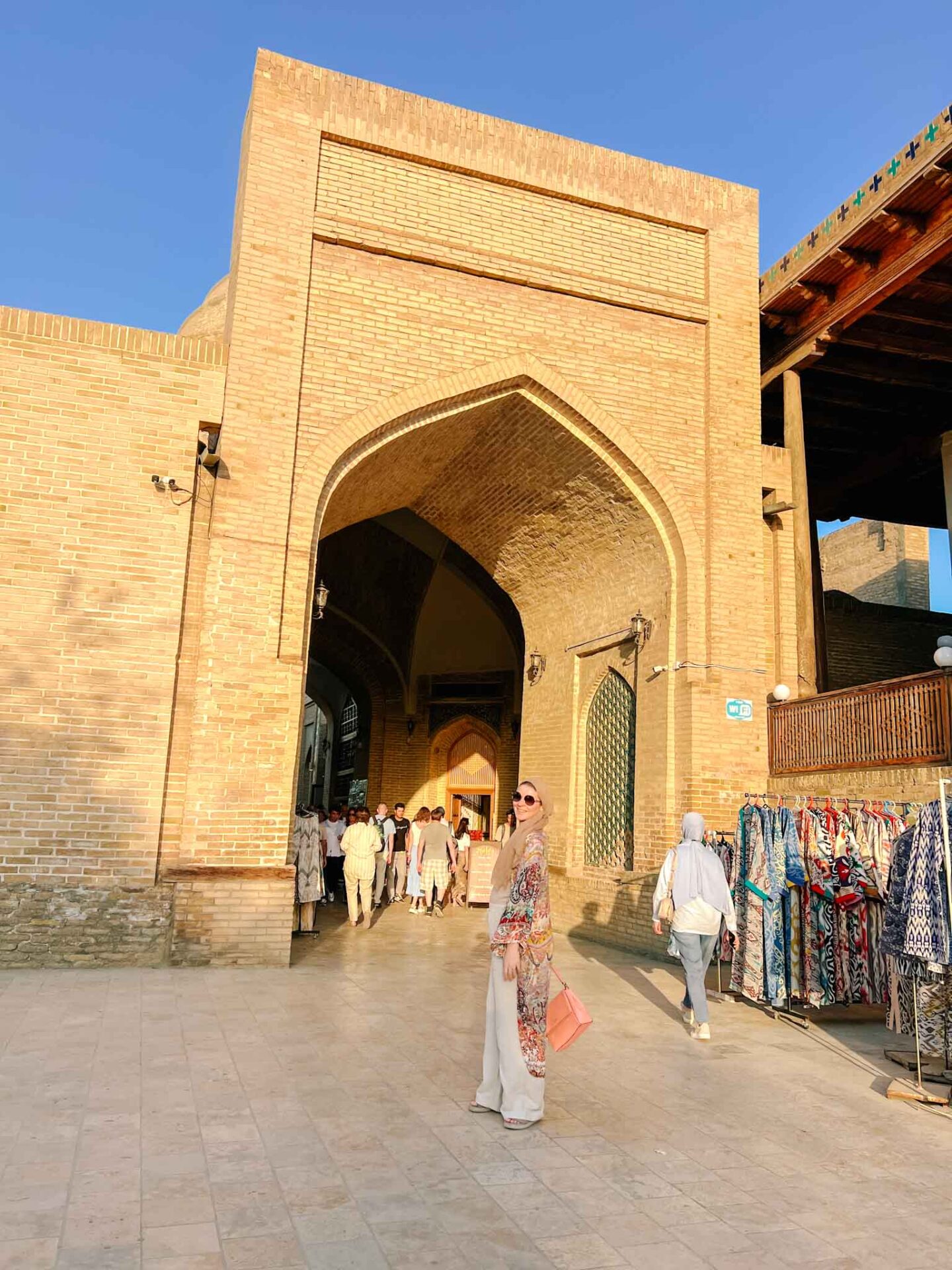 halal travel in Uzbekistan, Ellie outside trading dome in Bukhara - halal travel in Uzbekistan, Ellie outside trading dome in Bukhara