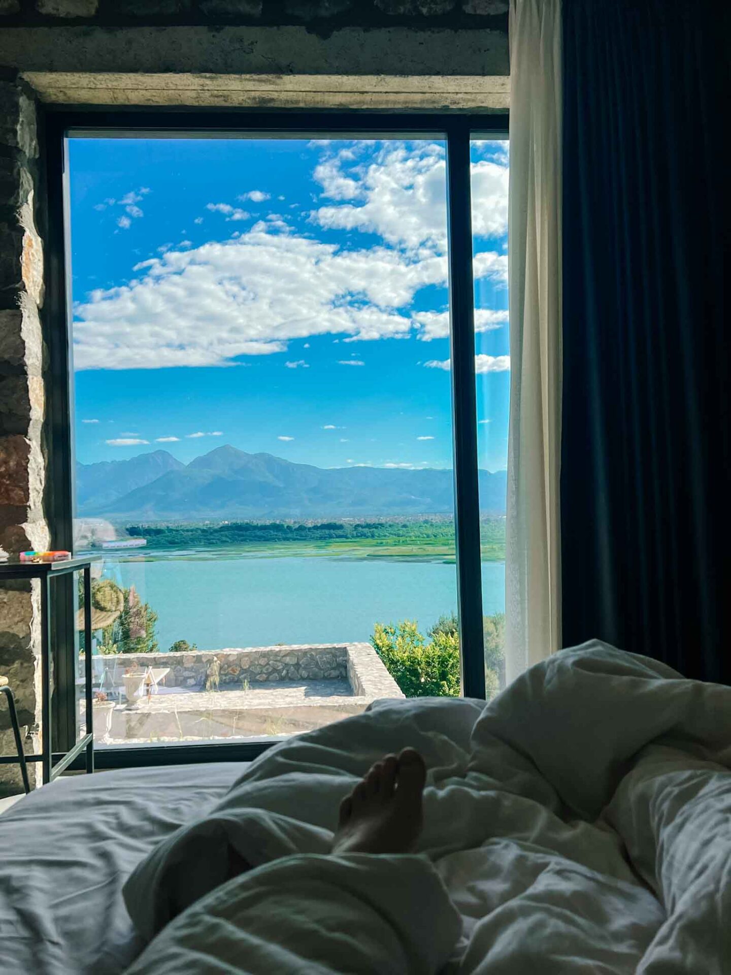 one day in Theth Albania, view of Lake Shkodar from bed at Rustico Hotel - one day in Theth Albania, view of Lake Shkodar from bed at Rustico Hotel