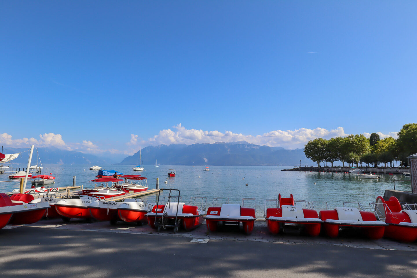 best countries to visit in June, lake in Switzerland with blue summer skies