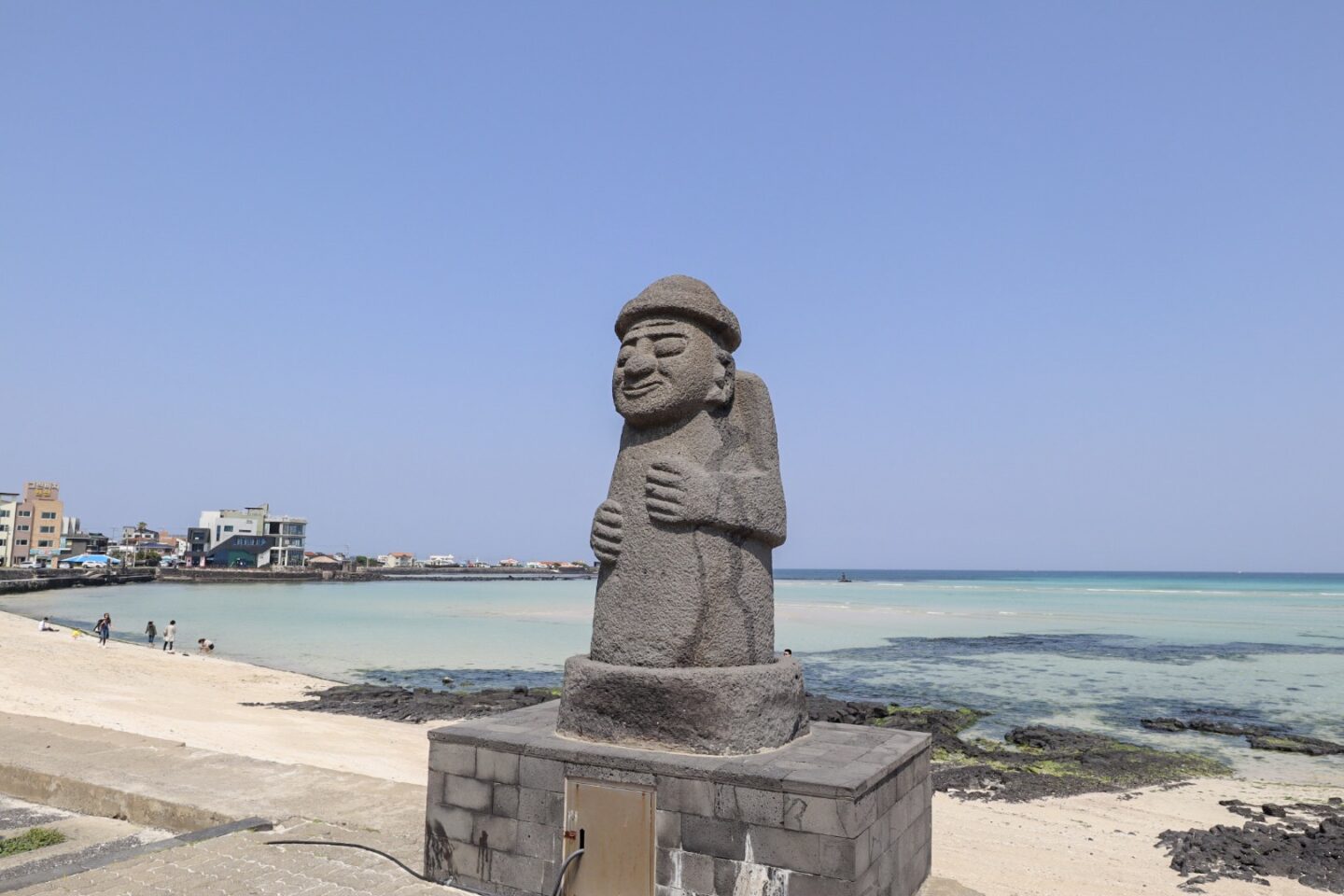best places in asia to visit in may, best places to visit in asia in June, statue by beach on jeju island