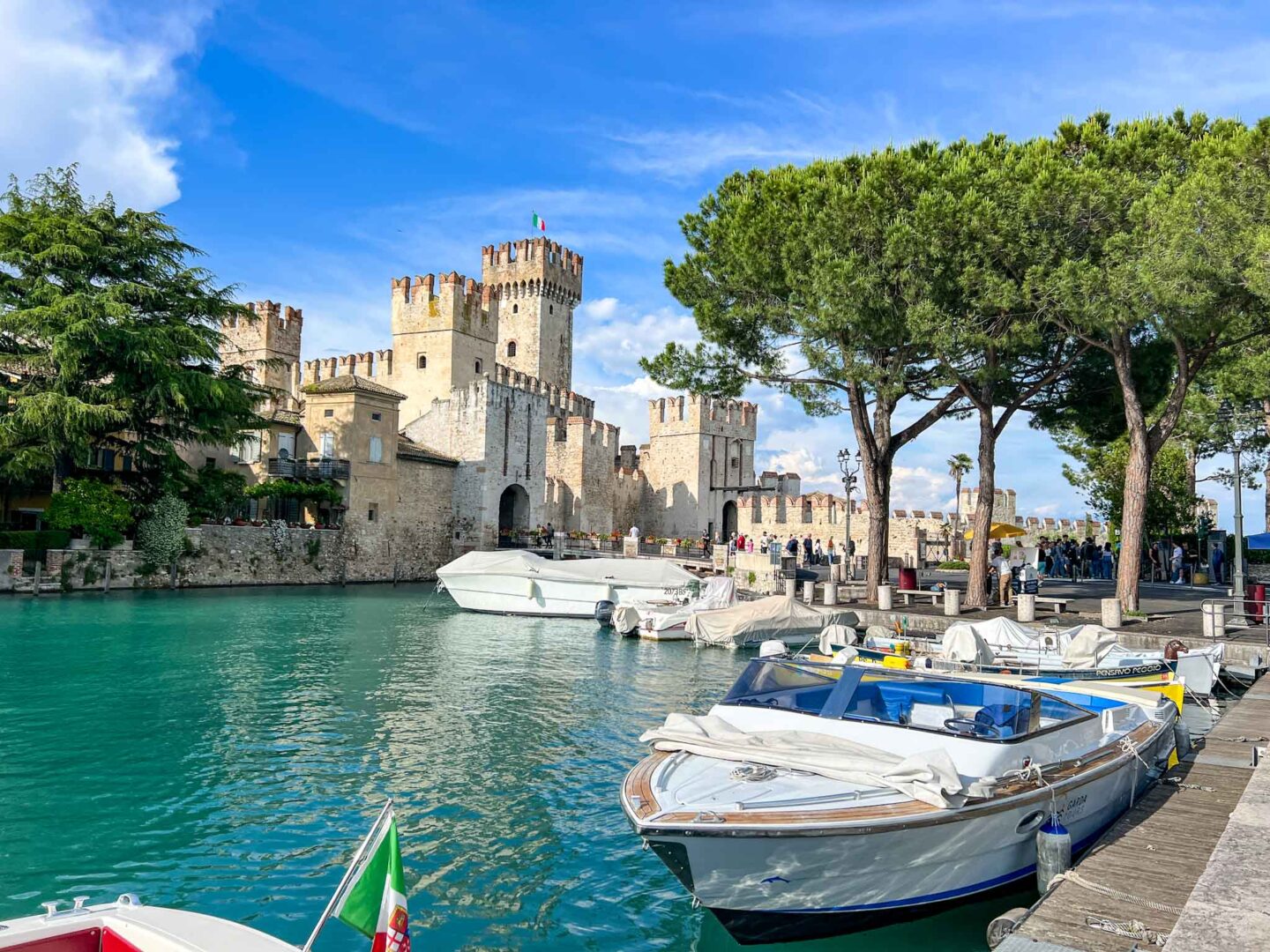 best places to go in June europe, Lake Garda village with castle in June